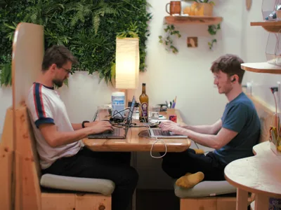 Residents writing at a table